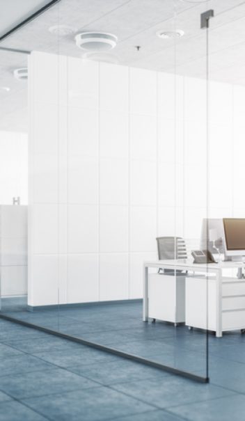 Modern Office With Glass Partition Walls Modern empty office with glass partition walls.